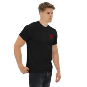 Unisex classic black crewneck t-shirt classic fit with small red KraftyBliss crest on left chest, right-front model view