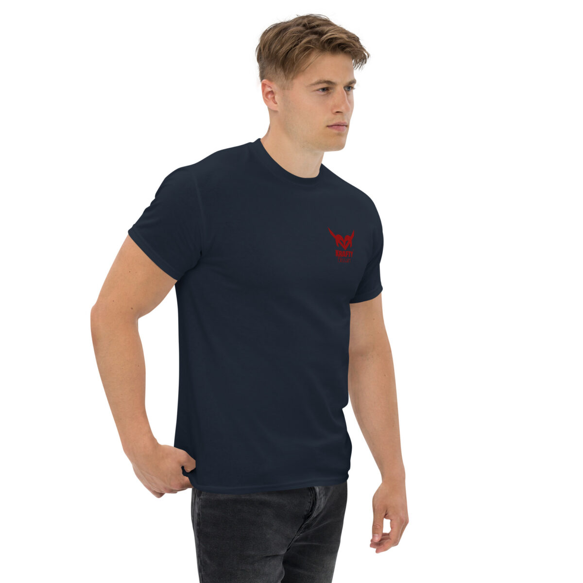 Unisex navy classic tee with small red KraftyBliss crest on left chest and maple leaf back graphic, right-front model view